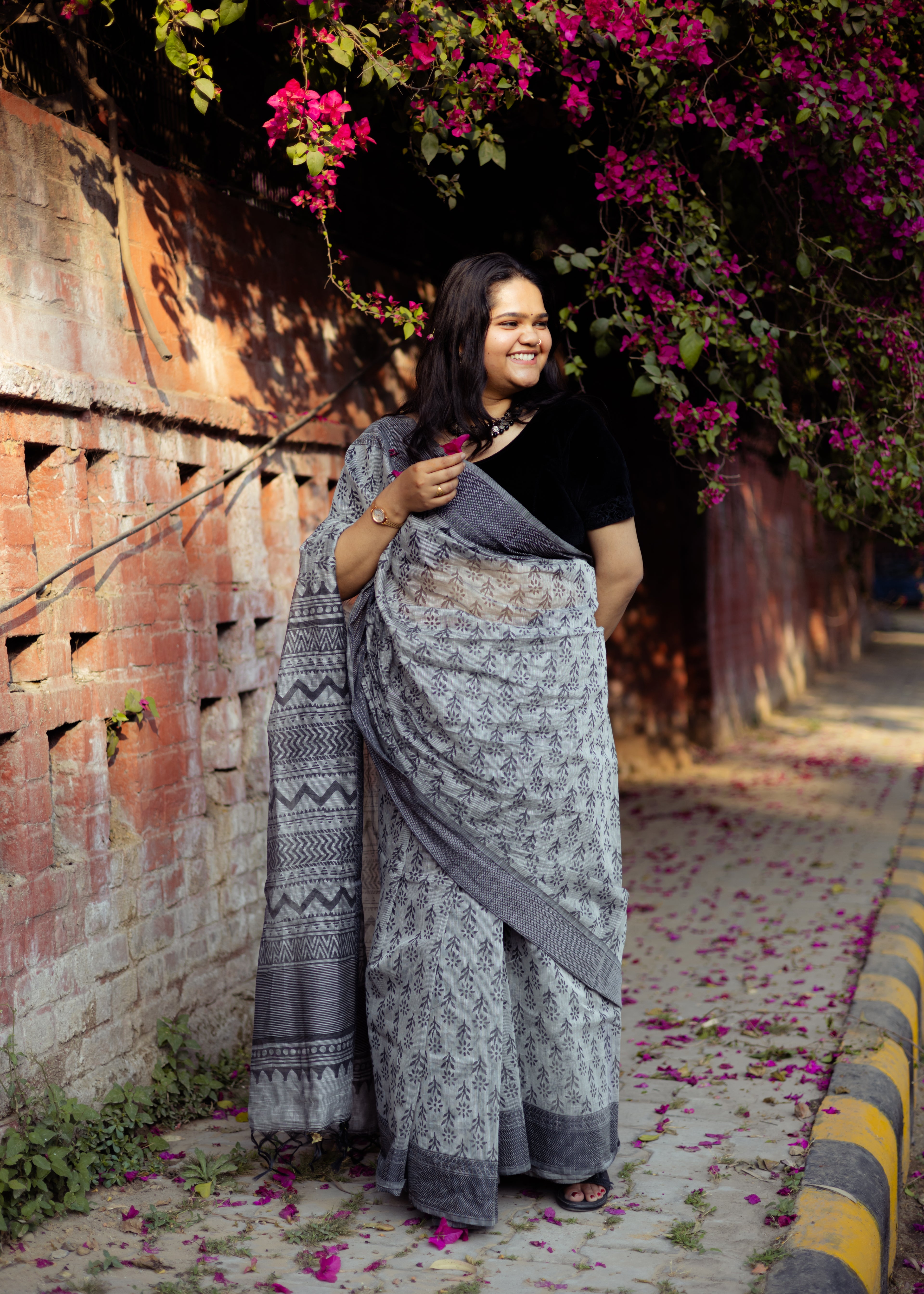 Cement Grey Kota doria Saree with black Motifs and tassle Pallu